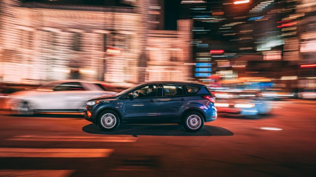 photo of suv on road during night time