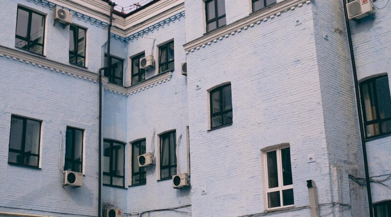 old house exterior with air conditioning units on walls