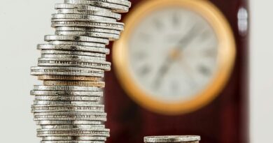 selective focus photo of stacked coins