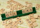 a wooden block with the word oil on it