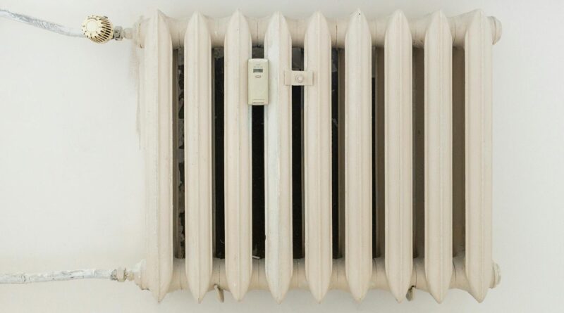 white steel rib radiator in a new bright renovated room in apartment or home