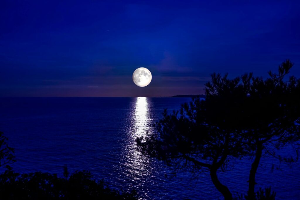 full moon reflecting in the sea