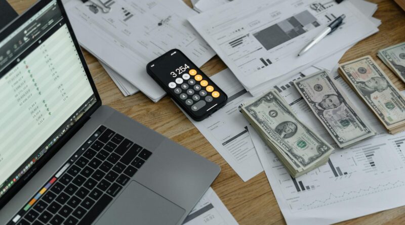 banknotes and calculator on table