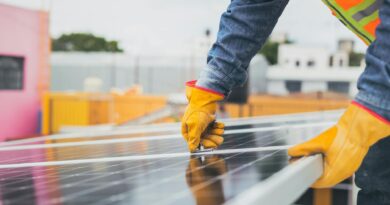 selective focus on maintenance man installing solar panel