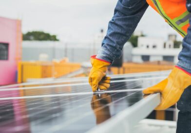 selective focus on maintenance man installing solar panel