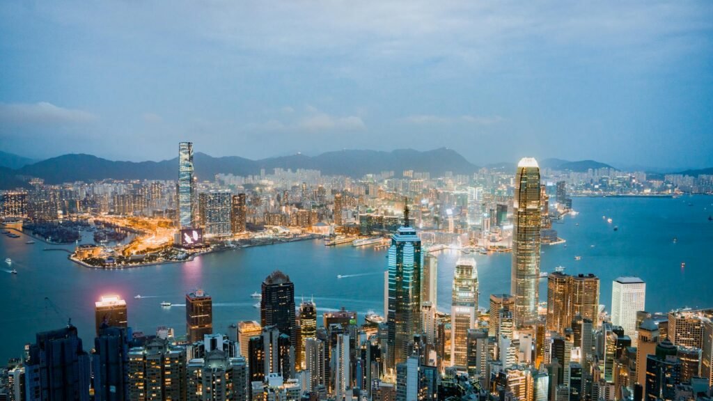 evening panorama of victoria harbor in hong kong