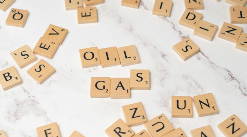 scrabble letters spelling out oil and gas