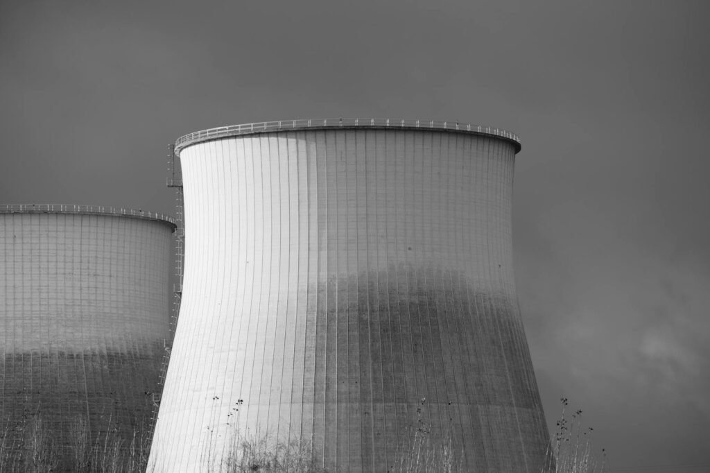 black and white photo of nuclear cooling towers