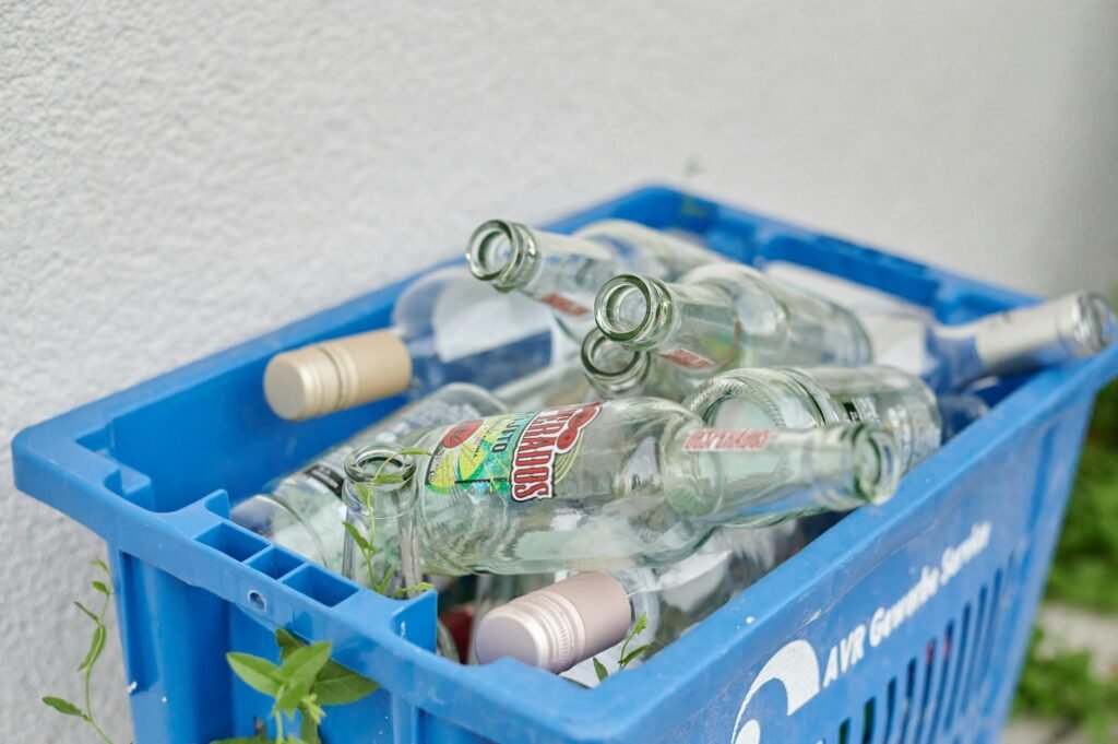 plastic crate with empty glass bottles