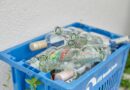 plastic crate with empty glass bottles