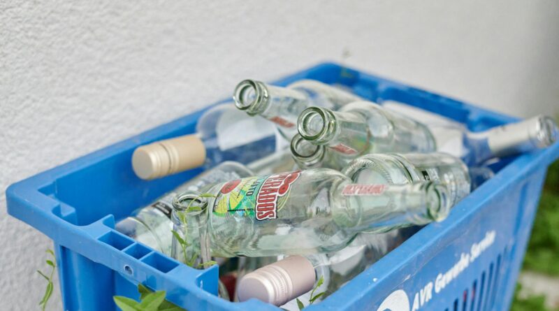 plastic crate with empty glass bottles