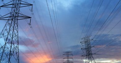 transmission tower under gray sky