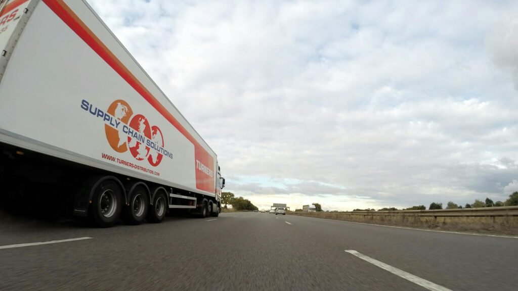 white trailer truck on concrete road