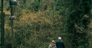elderly couple walking at park