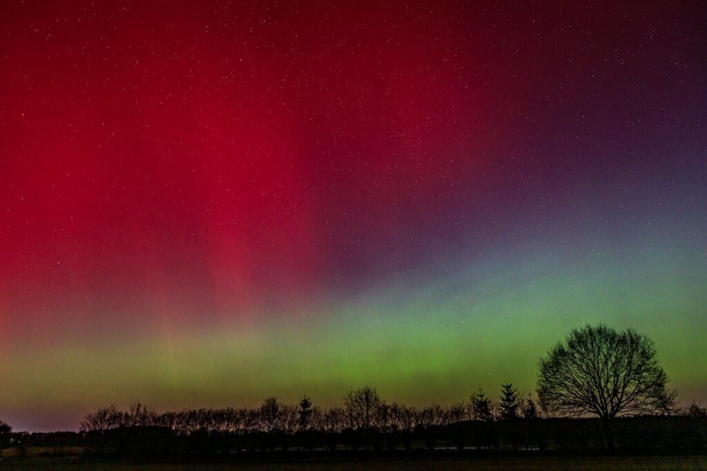 vibrant northern lights over night landscape