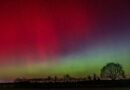vibrant northern lights over night landscape