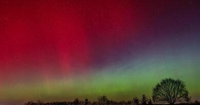 vibrant northern lights over night landscape