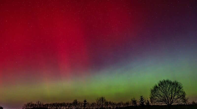 vibrant northern lights over night landscape