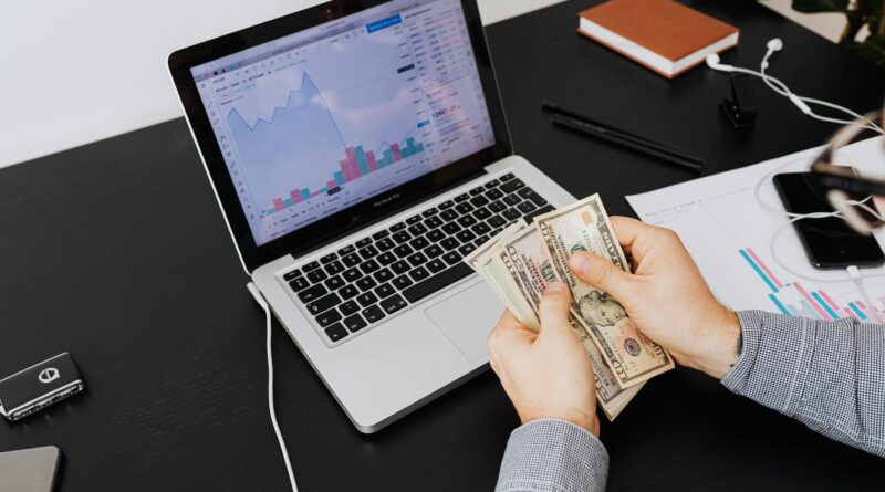 a person holding bank notes