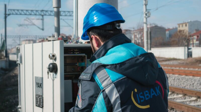 an electrician inspecting a fuse box
