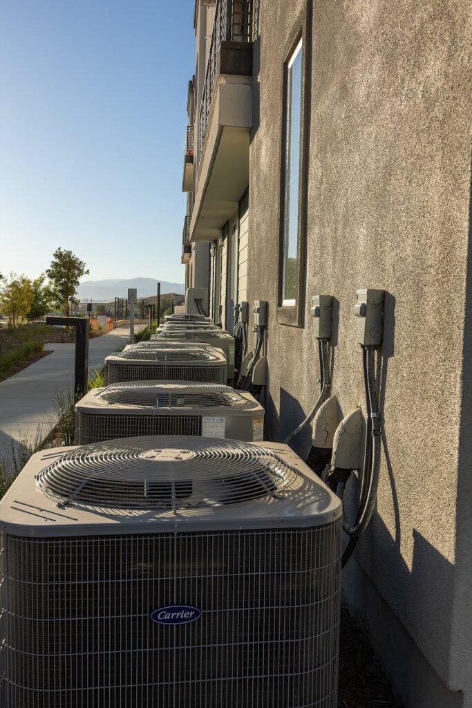 air conditioners attached to the back of a building