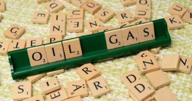 a wooden block with the word oil on it