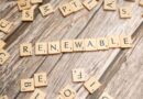 the word renewable written in scrabble letters on a wooden table