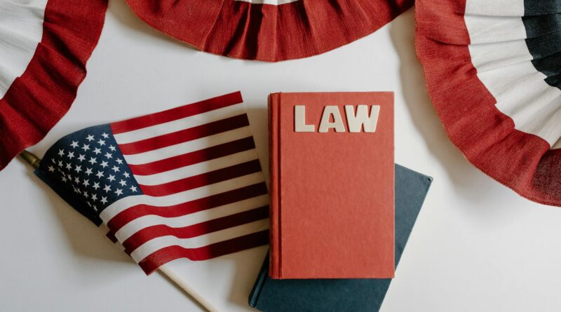 red and blue notebook beside american flag