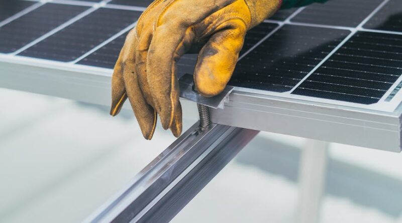 person s hand on top of solar panel
