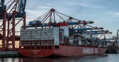 ship with containers in harbor