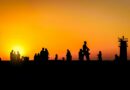 silhouettes against a vibrant sunset